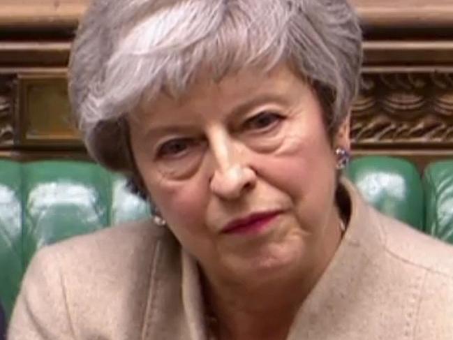 A video grab from footage broadcast by the UK Parliament's Parliamentary Recording Unit (PRU) shows Britain's Prime Minister Theresa May reacting as Labour Party leader Jeremy Corbyn speaks on a point of order in the House of Commons in London on March 29, 2019 after MPs rejected her EU Withdrawl deal for a third time. - MPs voted to reject for a third time Prime Minister Theresa May's Brexit divorce deal by 58 votes. (Photo by - / PRU / AFP) / RESTRICTED TO EDITORIAL USE - MANDATORY CREDIT " AFP PHOTO / PRU " - NO USE FOR ENTERTAINMENT, SATIRICAL, MARKETING OR ADVERTISING CAMPAIGNS - EDITORS NOTE THE IMAGE HAS BEEN DIGITALLY ALTERED AT SOURCE TO OBSCURE VISIBLE DOCUMENTS