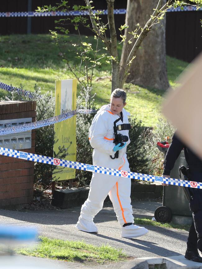 Police investigate the scene of a fatal shooting.