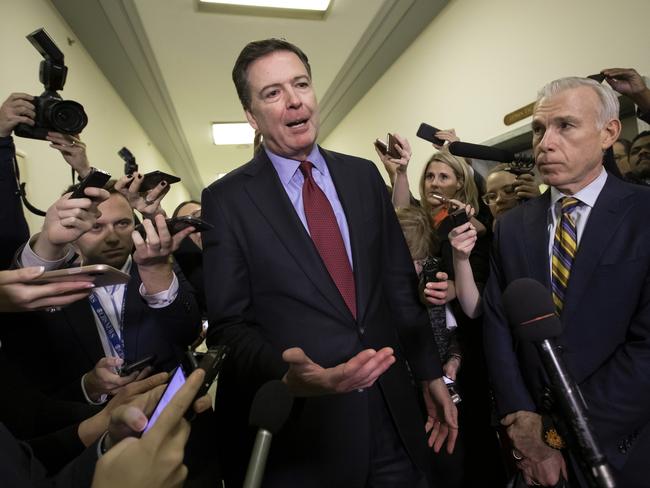 FILE - In this Dec. 7, 2018, file photo, former FBI Director James Comey, with his attorney, David Kelley, right, speaks to reporters after a day of testimony before the House Judiciary and Oversight committees, on Capitol Hill in Washington. (AP Photo/J. Scott Applewhite, File)