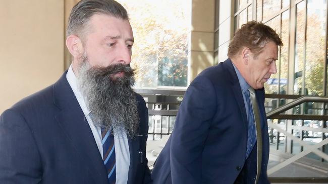 Mark 'Bomber' Thompson, right, arrives at Melbourne Magistrates Court. Picture: Getty Images