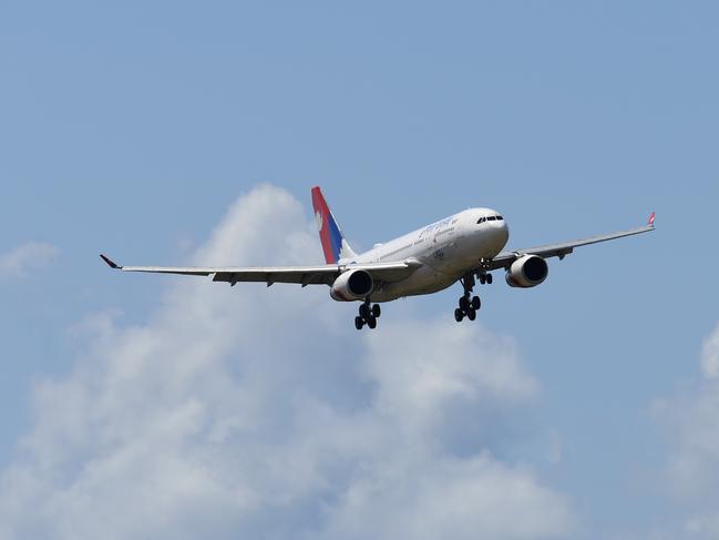 A special Nepal Air flight, repatriating Australian and New Zealanders from overseas, arrives in Brisbane, Thursday, April 2, 2020. The chartered flight out of Nepal had 222 Australians and 28 New Zealand citizens and permanent residents onboard. (AAP Image/Dan Peled) NO ARCHIVING