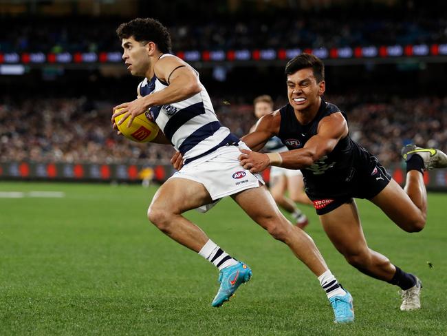 Tyson Stengle of the Cats is tackled by Jesse Motlop of the Blues during the 2022 AFL Round 18 match. (Photo by Dylan Burns/AFL Photos via Getty Images)