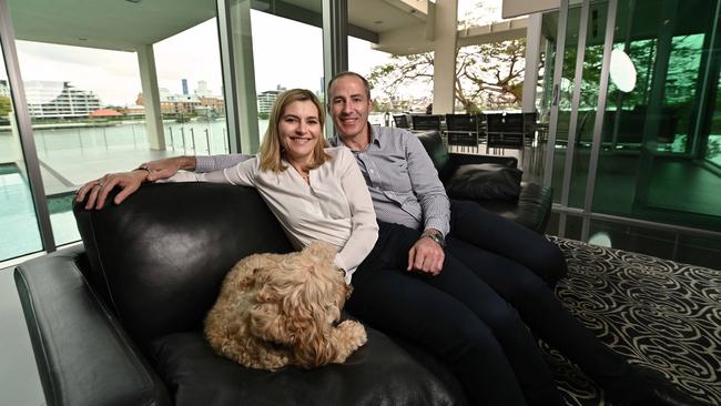 Brisbane developer Tom Dooley with wife Emily and their dog Toffee, in their riverfront home at Hawthorne, Brisbane. Picture: Lyndon Mechielsen