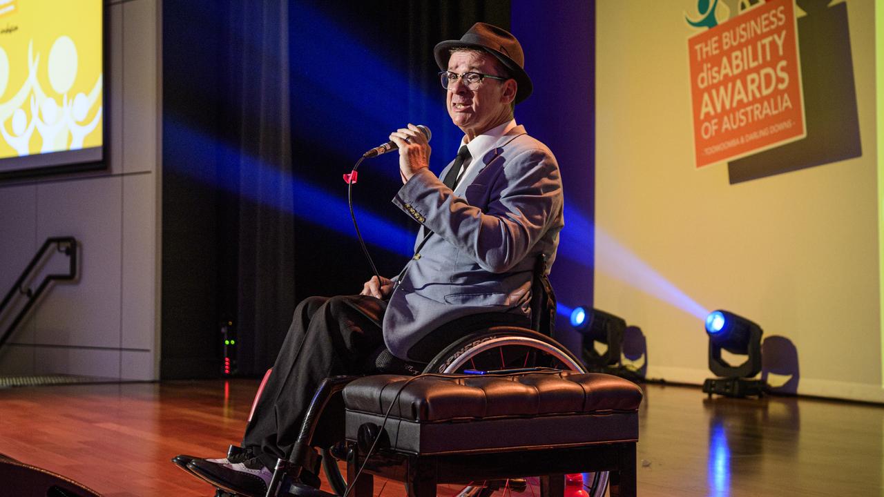 Tony Dee on stage at the Business disAbility Awards of Australia at Edmund Rice Cultural Centre, Saturday, May 17, 2025. Picture: Kevin Farmer