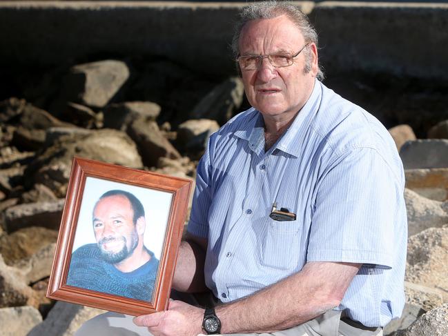 13/5/14 - Commercial fisherman Jack Salvemini was killed on a shark fishing boat in 2005. The boat's captain had a workplace convinction overturned on appeal, but the Salvemini family is pushing for a coronial inquest. JACKS DAD LEE SALVEMINI AT THE NORTH HAVEN BOAT RAMP HOLDING A PICTURE OF HIS SONPic Simon Cross