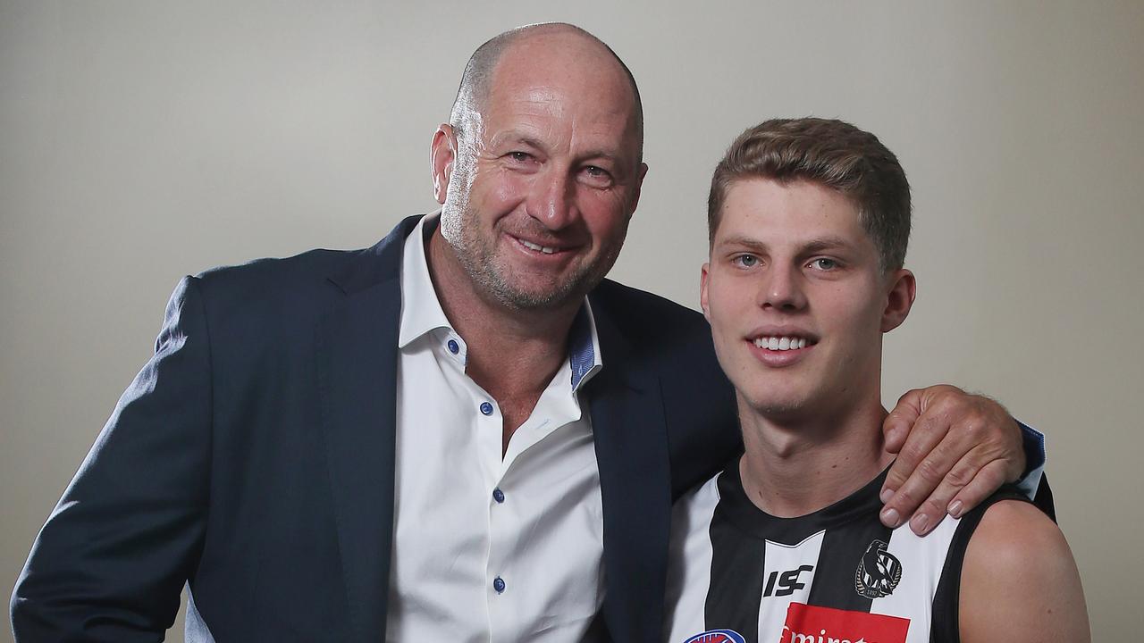 Craig Kelly, pictured with son Will, is one of the most influential voices in the football industry. Picture: Michael Klein