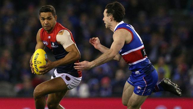 Toby McLean (right) injured his hamstring against the Dees. Picture: AAP