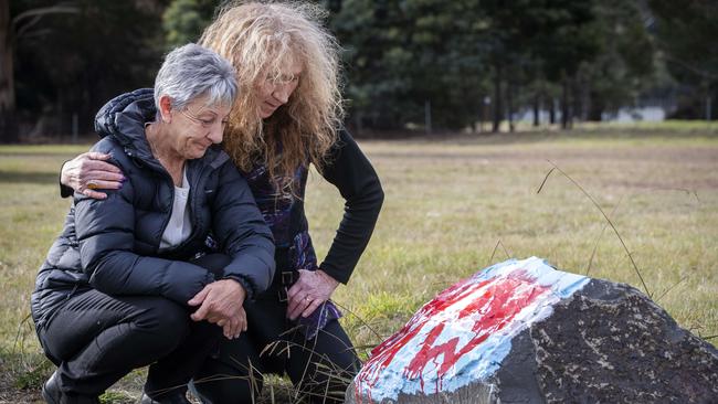 Rosemary Harwood (the mother of Marjorie Harwood, a trans woman who was raped at Risdon Prison and died soon after her release) and Martine Delaney outside Risdon Prison at the vandalised memorial. Picture: Chris Kidd