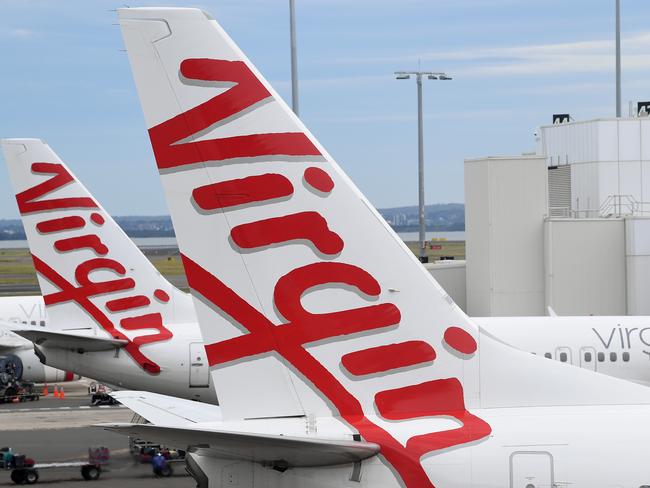 SYDNEY, AUSTRALIA - NCA NewsWire Photos DECEMBER, 18, 2020: A Virgin Australia aircraft at the Domestic terminal at Sydney Airport in Sydney. Picture: NCA NewsWire/Joel Carrett