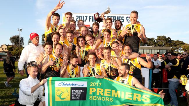 Frankston YCW show off their 2017 premiership flag last year. Picture: Mark Dadswell