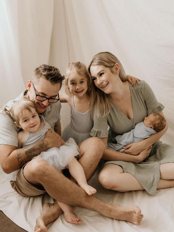 Brendan Tyrrell and his wife Aliesha with their young children.