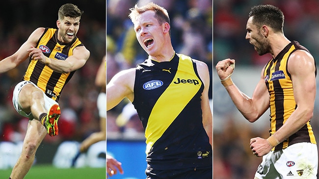 Two Hawks in Luke Breust and Jack Gunston sandwich Coleman Medallist Jack Riewoldt in attack.