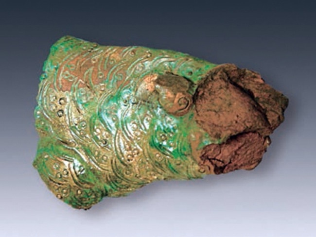 Greens and golds coloured this clay carp ornamet. Source: Chinese Cultural Relics