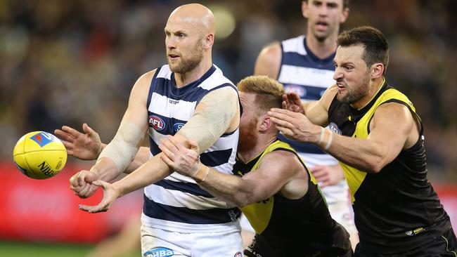 Geelong’s Gary Ablett clears by hand under pressure. Picture: Michael Klein