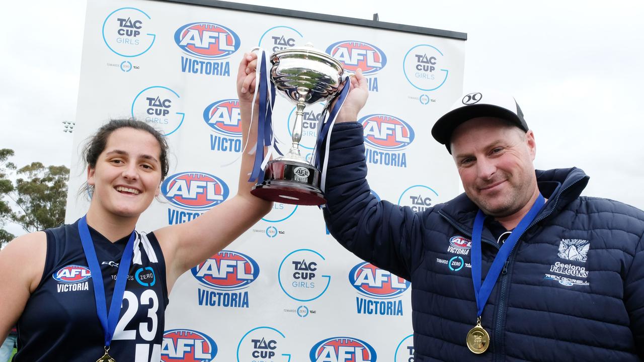 Lucy McEvoy lifts the 2018 TAC Cup Girls premiership cup alongside coach Jason Armistead Picture: Mark Wilson