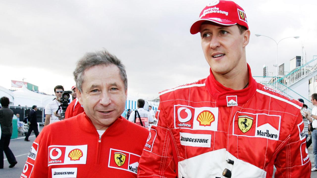 Ferrari driver Michael Schumacher, right, of Germany walks with the team's General Director Jean Todt. AP Photo/Andy Wong.