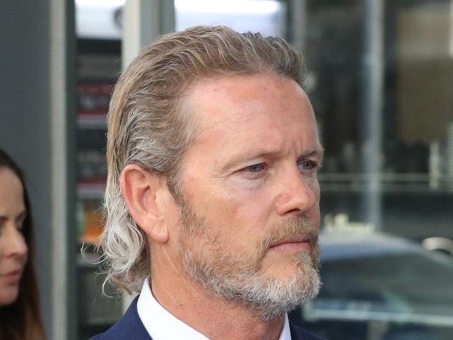 Australian actor Craig McLachlan leaves  the Melbourne Magistrates Court in Melbourne, Monday, November 18, 2019. McLachlan is charged with seven counts of indecent assault, one of attempted indecent assault and another of assault involving four complainants in Melbourne between April and July in 2014. (AAP Image/David Crosling) NO ARCHIVING