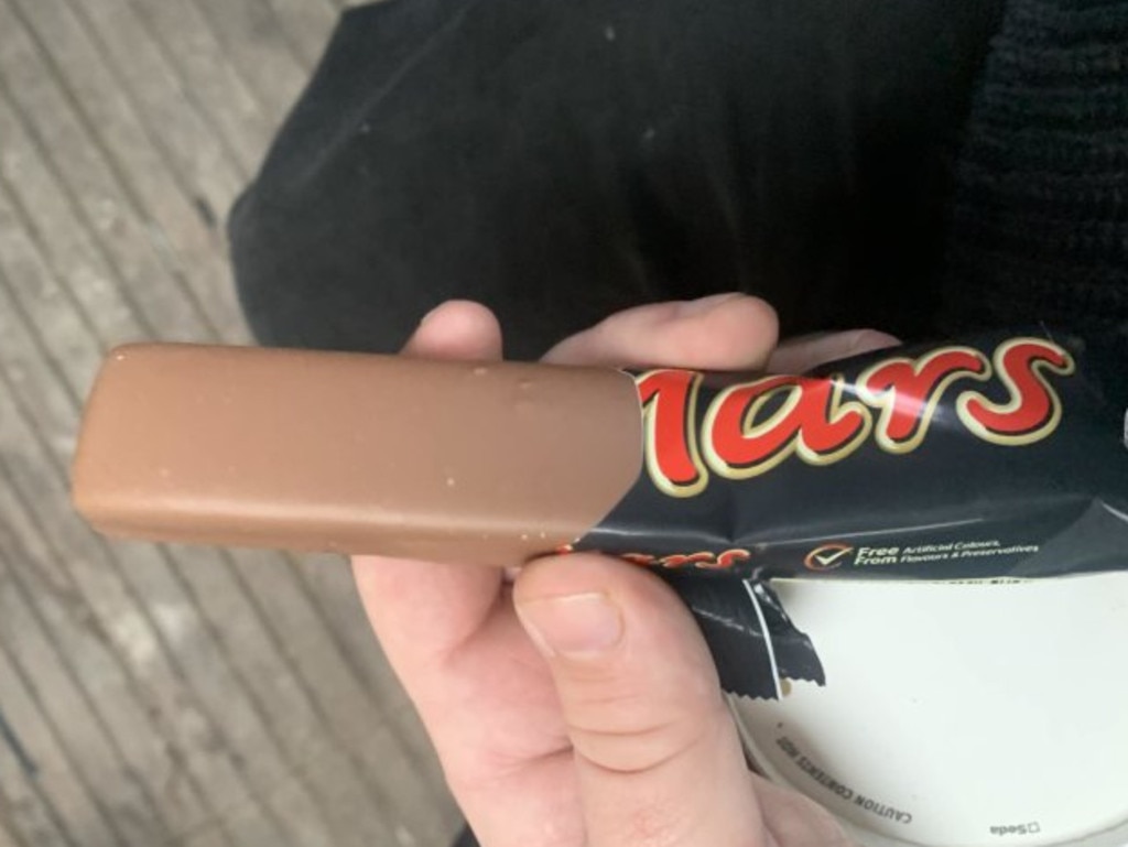 A UK man has received $3.91 in compensation and an apology after purchasing a Mars bar that was lacking its signature ripple. Picture: SWNS/Harry Seager