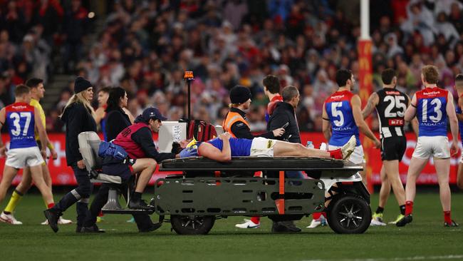 Angus Brayshaw is stretchered off the ground after being injured by Brayden Maynard in last year’s qualifying final.