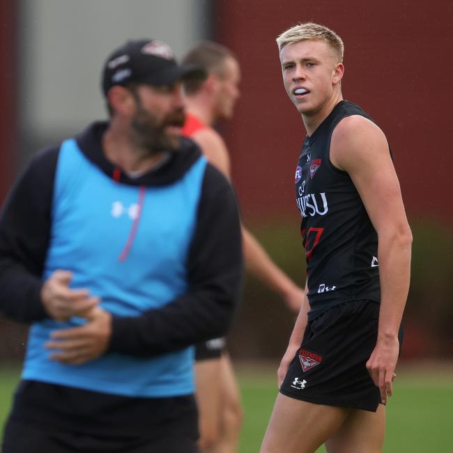 Essendon assistant coach Travis Cloke works with Bombers young gun Nate Caddy at training. (Photo by Daniel Pockett/Getty Images)