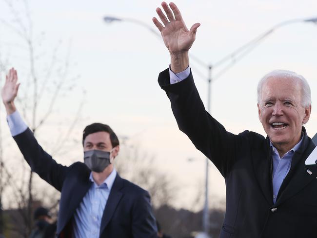 Joe Biden, right, rallys with Democratic Senate candidate Jon Ossoff. Picture: Getty Images