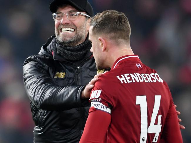 LIVERPOOL, ENGLAND - JANUARY 19:  Jurgen Klopp, Manager of Liverpool congratulates Jordan Henderson of Liverpool following the Premier League match between Liverpool FC and Crystal Palace at Anfield on January 19, 2019 in Liverpool, United Kingdom.  (Photo by Laurence Griffiths/Getty Images)