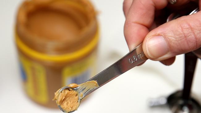 Evan Chu, 6, is given 1/16th of a tea spoon of peanut butter and soon after presents with swelling and hives. Pictures Tim Carrafa