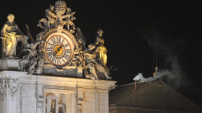 White smoke rises from the chimney on the roof of the Sistine Chapel in 2013 signifying that a new pope has been chosen. Picture: AFP.
