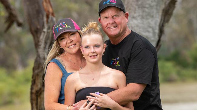 Tilly Wilkes, 12, who suffers a rare skin condition, with parents Kelly and Corey. Picture: Rob Leeson