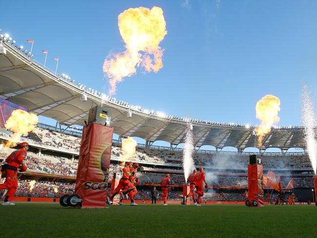 The Perth Scorchers players enter the field of play during the Big Bash League (BBL) cricket match between the Perth Scorchers and Adelaide Strikers at Optus Stadium in Perth, Friday, January 24, 2020. (AAP Image/Gary Day) NO ARCHIVING, EDITORIAL USE ONLY, IMAGES TO BE USED FOR NEWS REPORTING PURPOSES ONLY, NO COMMERCIAL USE WHATSOEVER, NO USE IN BOOKS WITHOUT PRIOR WRITTEN CONSENT FROM AAP