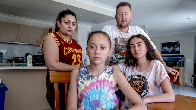 Danielle Beaton with husband Eric and daughters Tanahya and Aalihya at home in Truganina in Melbourne’s west. Picture: Luis Enrique Ascui