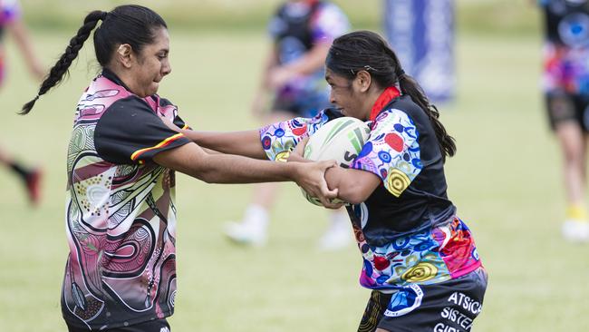 Cydnee Young (left) of Toowoomba Warriors against Tallara Taylor of ATSiCHS – Sister Girls in the Warriors Reconciliation Carnival women's games hosted by Toowoomba Warriors at Jack Martin Centre, Saturday, January 18, 2025. Picture: Kevin Farmer