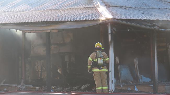 The burnt front of Smoke n Gifts in Bakery Hill.