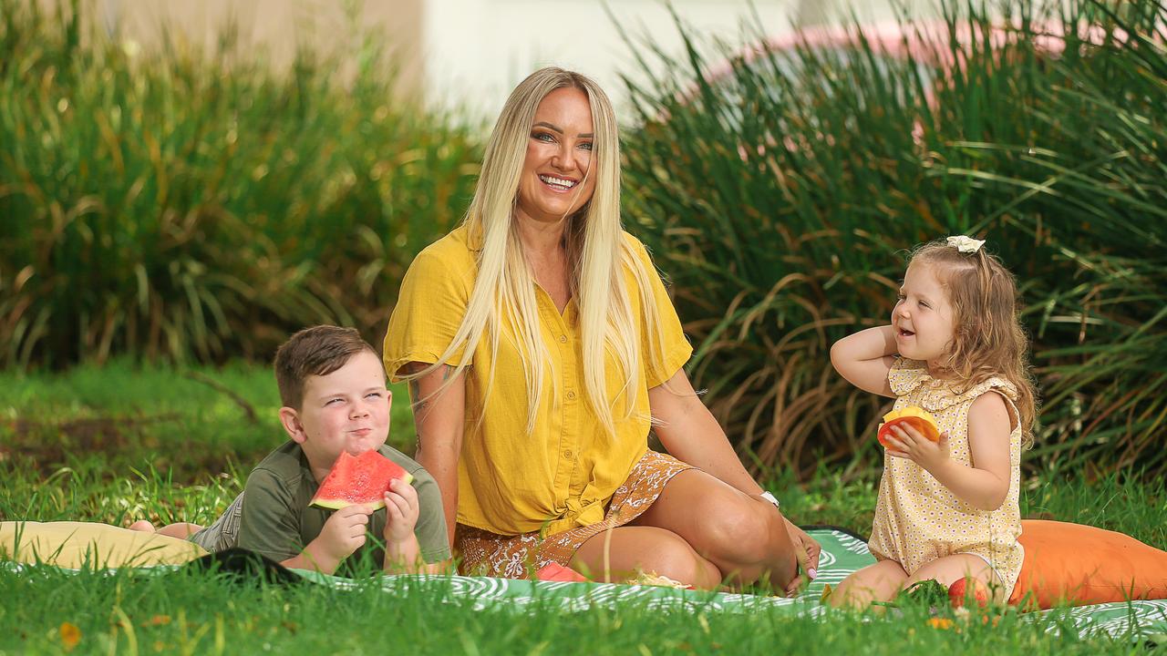 Gold Coast Mum Jacinta Rogers with her kids Reine and Myah Rogers-Birrell. Picture: Glenn Campbell