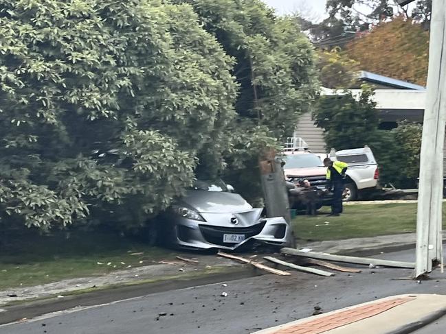 A crash between a car and power pole at Lindisfarne. Image: Patri Aviles/Facebook