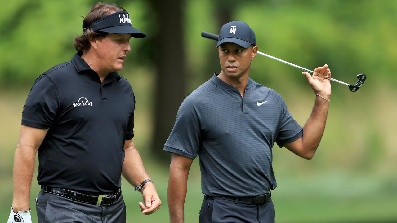 Phil Mickelson (L) and Tiger Woods are about to go head to head.
