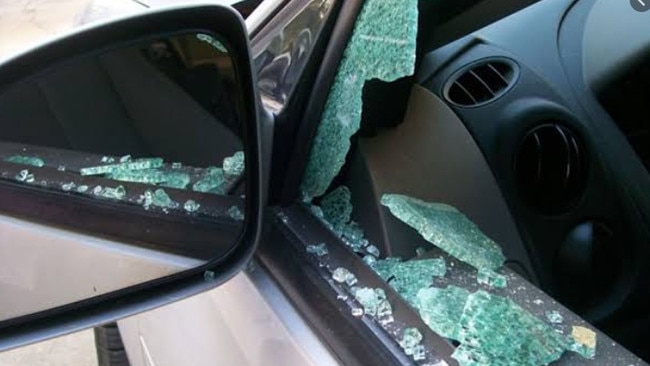 A car damaged during a vandal spree at Merinda Park railway station.