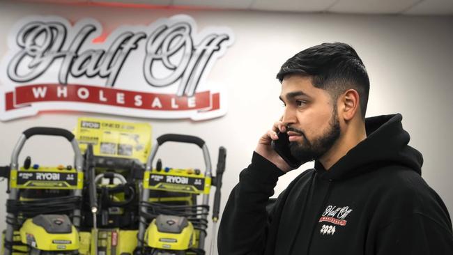 Edgar Guzman, CEO of Half-Off Wholesale, takes a call at his Atlanta warehouse. Picture: Nicole Craine/WSJ