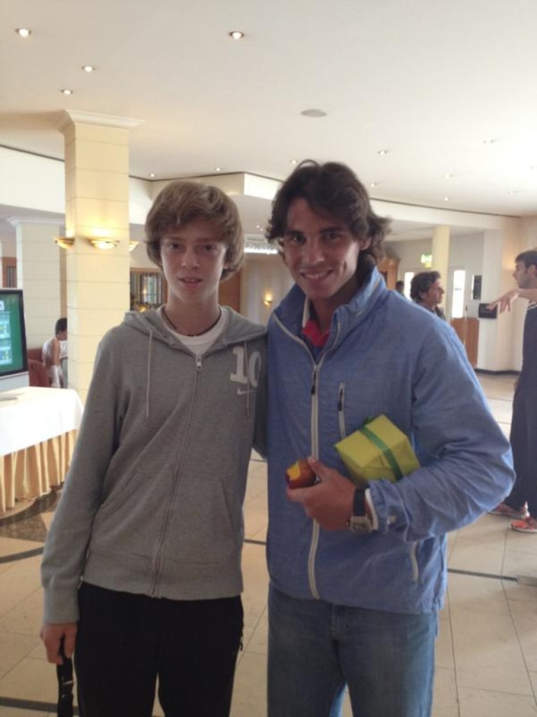 A young Andrey Rublev with Rafa Nadal.