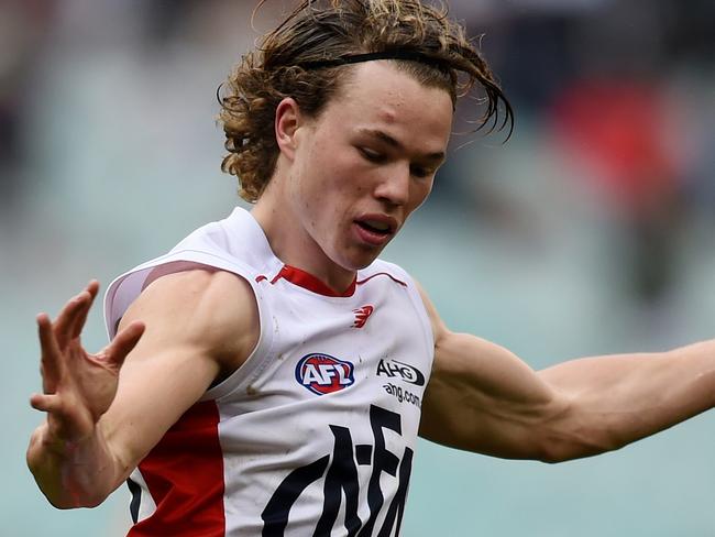 Jayden Hunt of the Demons kicks during their round 22 AFL match between the Carlton Blues and the Melbourne Demons at the MCG in Melbourne, Saturday, Aug. 21, 2016. (AAP Image/Tracey Nearmy) NO ARCHIVING