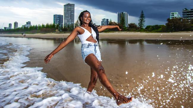 Linda Jerop from Main Beach as storms roll across Burleigh Heads on the Gold Coast earlier this month Picture: Nigel Hallett