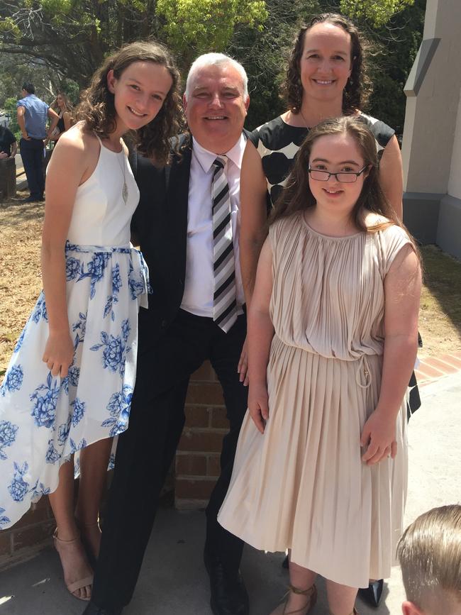 Perry and Jane Gilsenan with daughters Molly (left) and Grace.