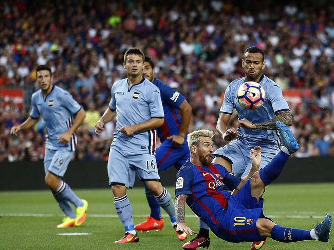 FC Barcelona's Lionel Messi sets up Luis Suarez’s goal.