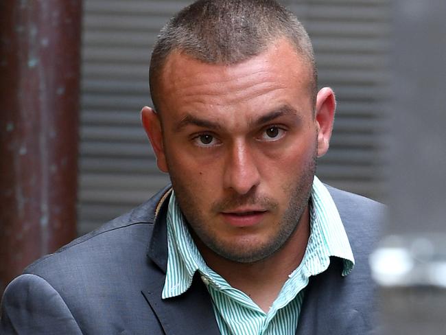 Diego Carbone is led to a prison transfer van at the NSW Supreme Court in Sydney, Thursday, March 22, 2018. Carbone has been sentenced to at least 21 years in prison for murdering father of two Bradley Dillon who was shot and stabbed after being lured to a Leichhardt car park in August 2014. (AAP Image/Dan Himbrechts) NO ARCHIVING