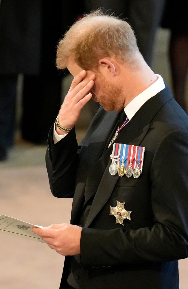 Prince Harry has been relegated to the third row. (Photo by Christopher Furlong / POOL / AFP)