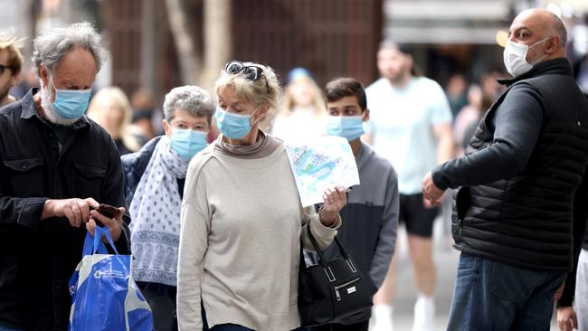 People are being urged to consider wearing masks in certain settings as Covid-19 cases start to rise in Queensland. File picture: Steve Pohlner