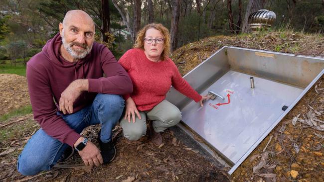 Daniel Katz and Jody Roberts with their bushfire bunker in their Bridgewater backyard. Picture: Ben Clark