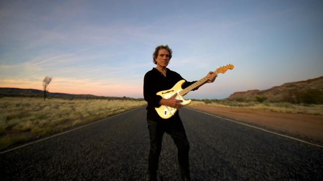 Ian Moss of Cold Chisel pictured near Alice Springs with a favourite Fender Stratocaster in 2022. Picture: Robert Hambling