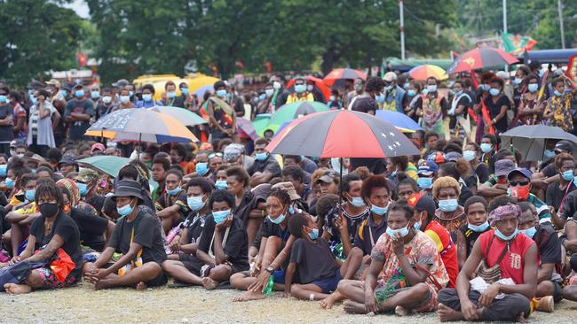 Mourners attend the funeral of former PNG prime minister Sir Michael Thomas Somare, sparking fears of a health crisis. Picture: Andy Hau