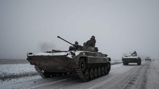 Ukrainian combat vehicles drive in a convoy through the Donetsk region in the east of the country. Picture: AFP